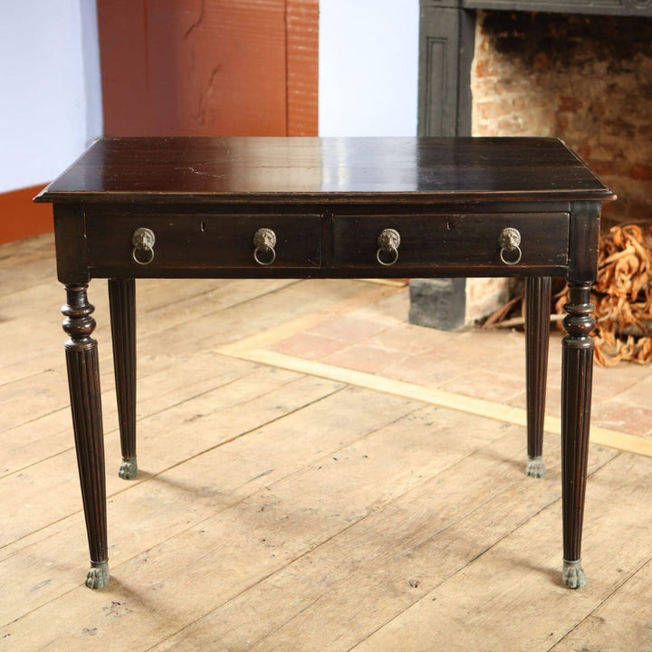 Anglo Indian Ebonised Writing Table mid 19th century black wood with lion mask handles and brass paw feet circa 1860