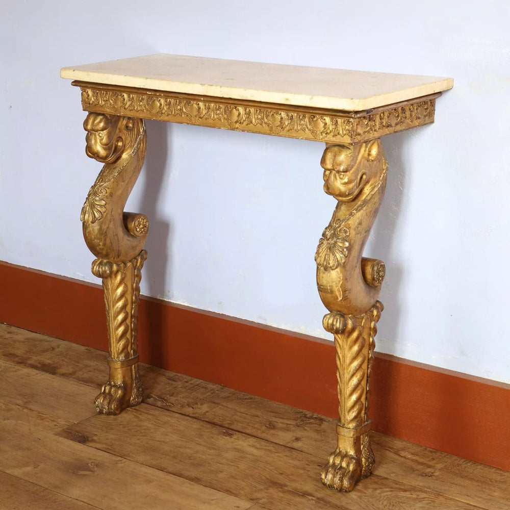 Regency Giltwood Console Table After the Antique with white marble top and gilt chimera supports circa 1810 England.