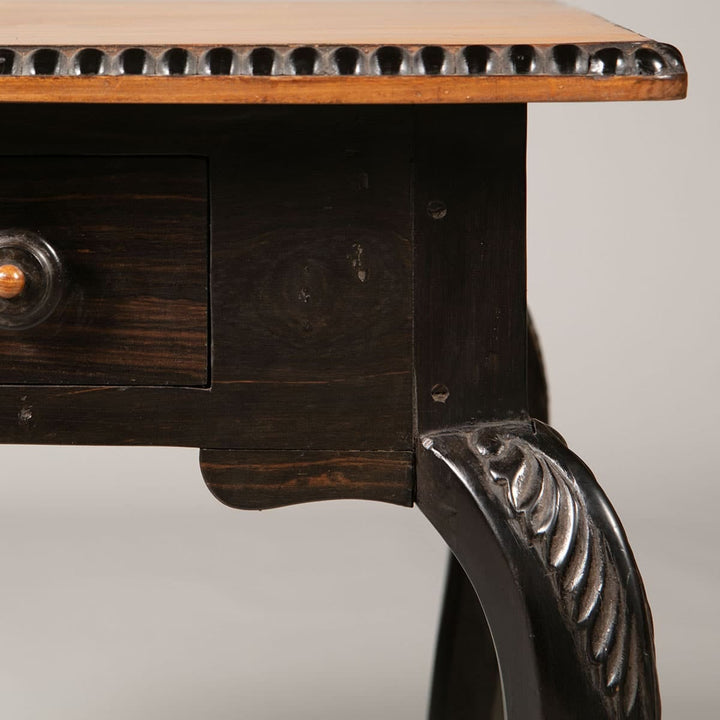 Pair of Antique Ceylonese Side Tables with solid satinwood tops, ebony cabriole legs, carved foliate details, and single drawer.