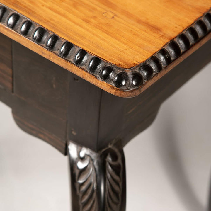 Pair of Antique Ceylonese Side Tables with solid satinwood tops, ebony cabriole legs, and carved foliate details.
