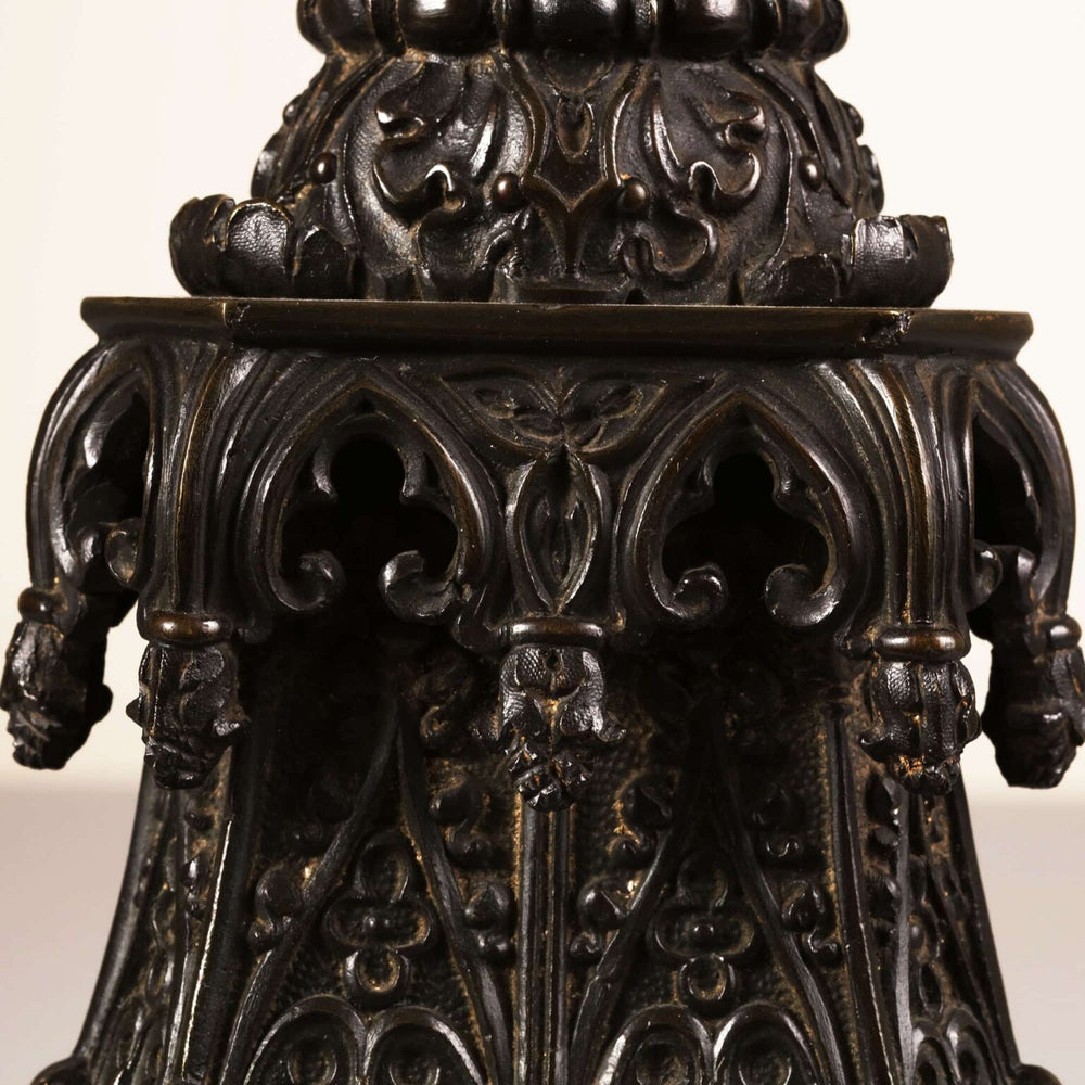 A William IV bronze gothic column lamp with intricate medieval-style figures and decorative gothic niches.