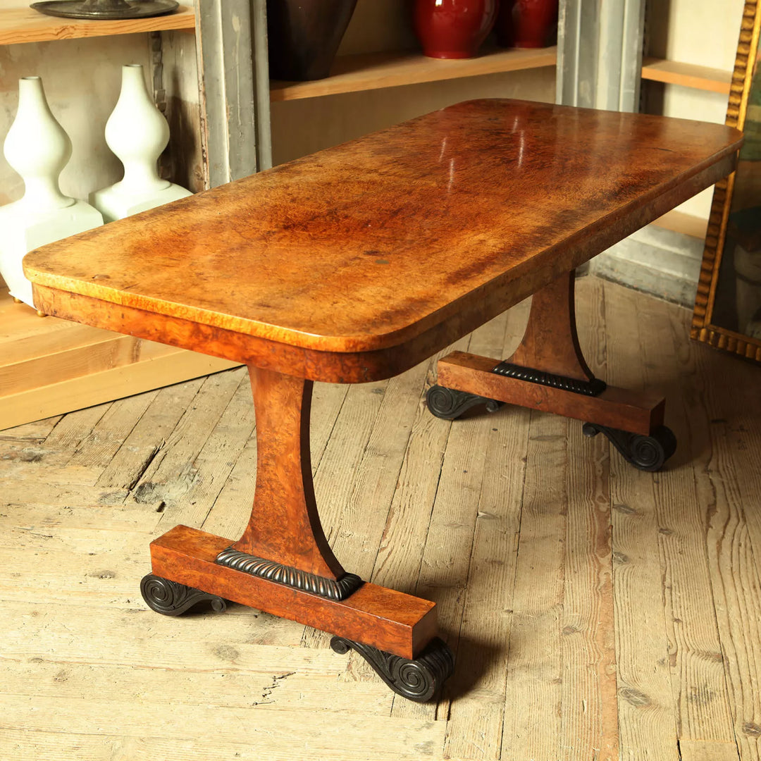 William IV End Support Amboyna Veneered Writing Table with rich wood grain and elegant supporting legs circa 1830