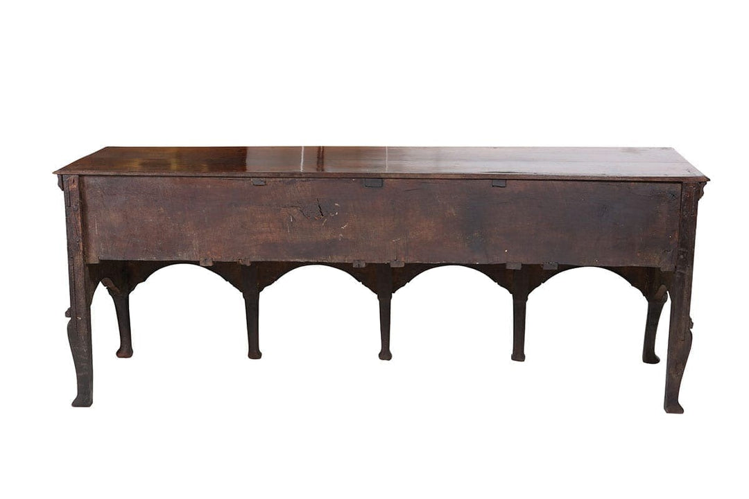 Early Georgian Oak Sideboard with flat top, thumb moulding, four drawers, brasswork, cabriole legs, pad feet circa 1720 England.