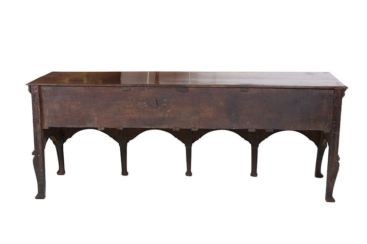 Early Georgian Oak Sideboard with flat top, thumb moulding, four drawers, brasswork, cabriole legs, pad feet circa 1720 England.
