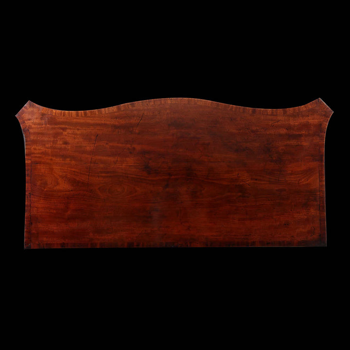 AN IMPORTANT GEORGE III MAHOGANY COMMODE Attributed to William Gomm with serpentine top and carved details circa 1760