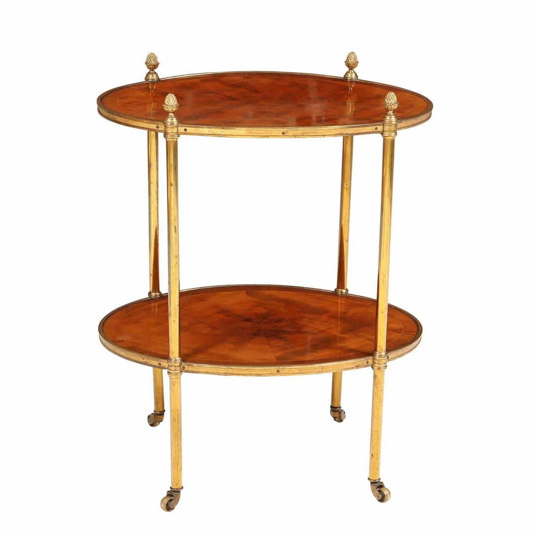 Quarter Veneered Bookmatched Mahogany Oval 2 Tier Table with brass accents and casters, England circa 1910.