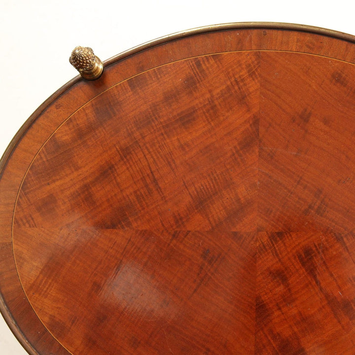 Quarter Veneered Bookmatched Mahogany Oval 2 Tier Table top showing detailed wood grain and brass edging