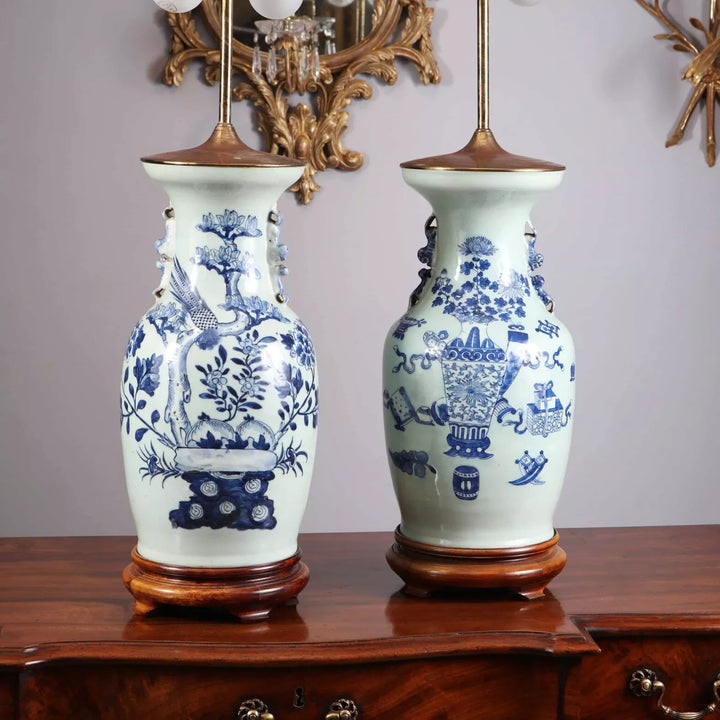 Chinese Blue and white table lamps with bird and vase designs on wooden bases, circa 1950, 50 cm tall.