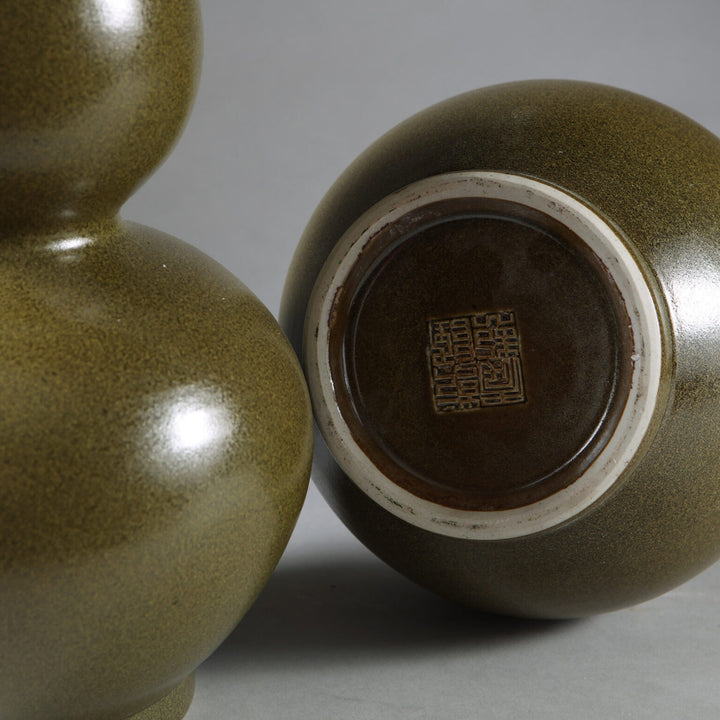 Pair of speckled green double gourd vase lamps showing textured surface and Chinese maker's mark base.