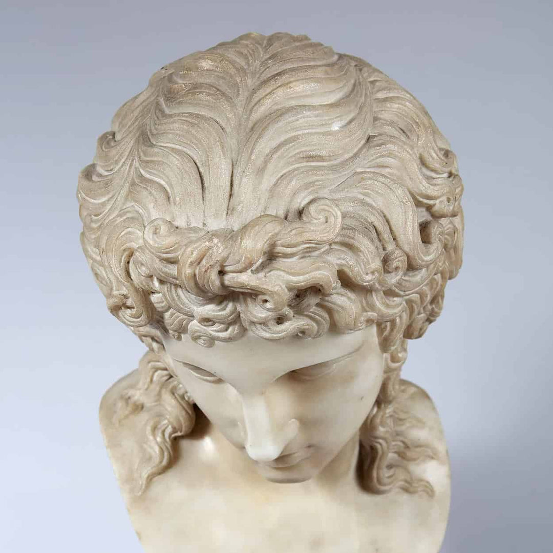 Eros Di Centocelle marble bust with detailed curly hair, antique style on Siena marble plinth, circa 1800 Italy.
