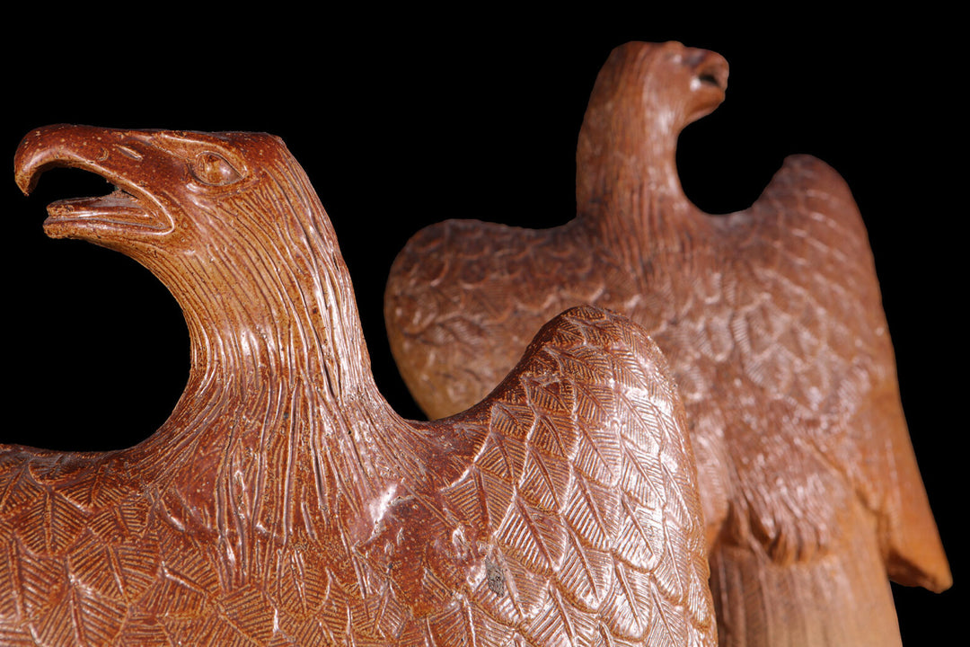 Pair of 19th century Salt Glazed Eagles pottery with detailed incised wings and open beaks, England circa 1880.