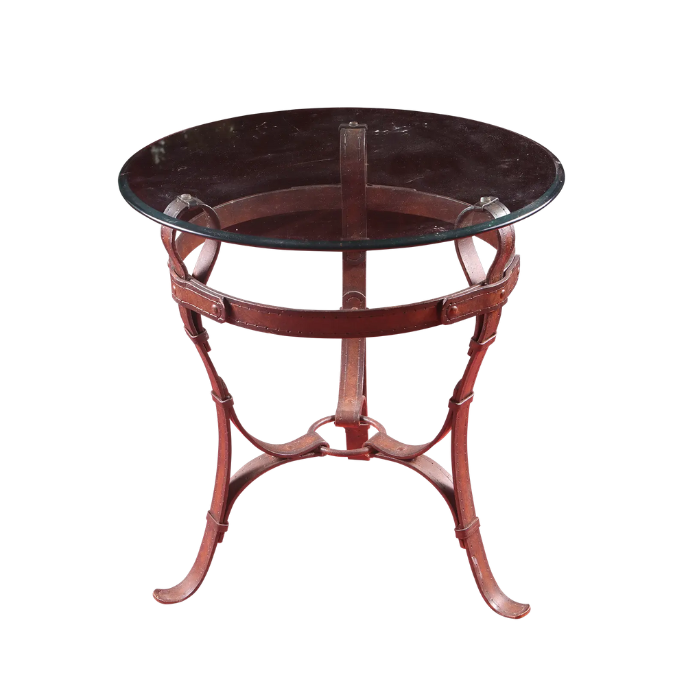 Wrought Iron Belt Strap End table with circular beveled glass top and belt strap frame with stitching and rivets.