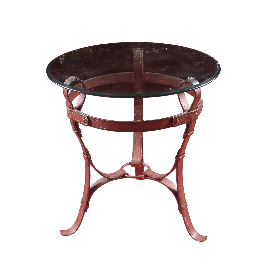 Wrought Iron Belt Strap End table with circular beveled glass top and belt strap frame with stitching and rivets.