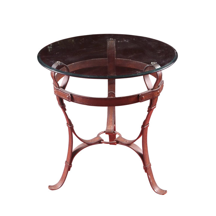 Wrought Iron Belt Strap End table with circular beveled glass top and belt strap frame with stitching and rivets.