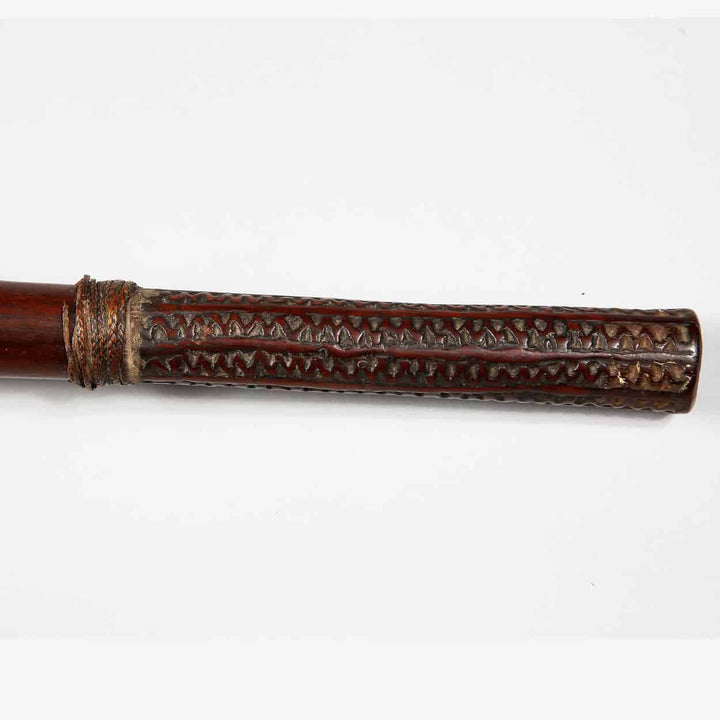 Close-up of carved handle on Ula Fijian War Club – Ethnographic Oceanic Throwing Club with detailed patterns and leather wrap.