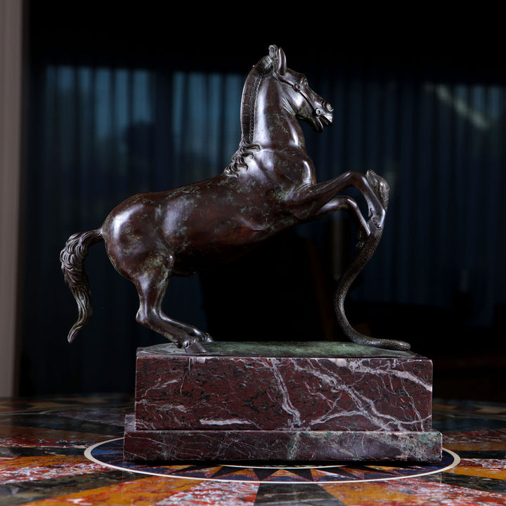 Grand Tour Equestrian Bronze statue of a rearing horse evading a striking snake on a marble base.