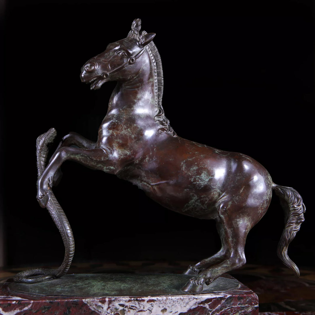 Grand Tour Equestrian Bronze showing a rearing horse evading a striking snake on a marble base circa 1830 Italy.