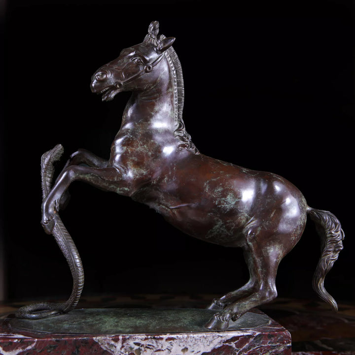 Grand Tour Equestrian Bronze showing a rearing horse evading a striking snake on a marble base circa 1830 Italy.