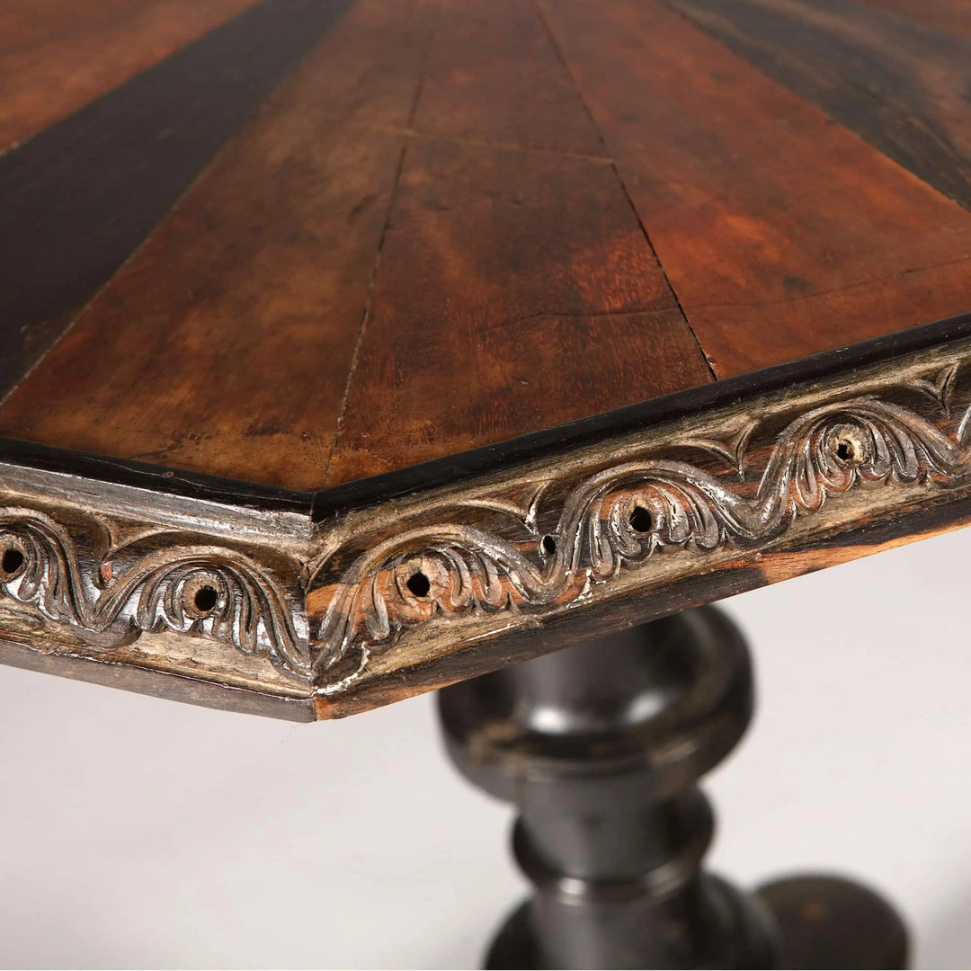Ceylonese Specimen Wood Occasional Table with octagonal top, carved calamander border, turned ebony base, 19th century style.