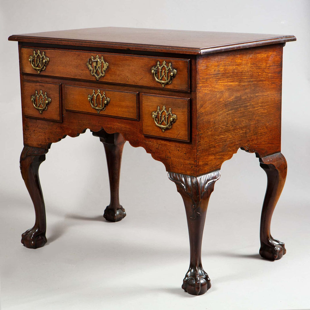 George I Oak Low Boy with thumb molded top, gothic brass handles, ogee apron, and ball claw feet with shell motif.