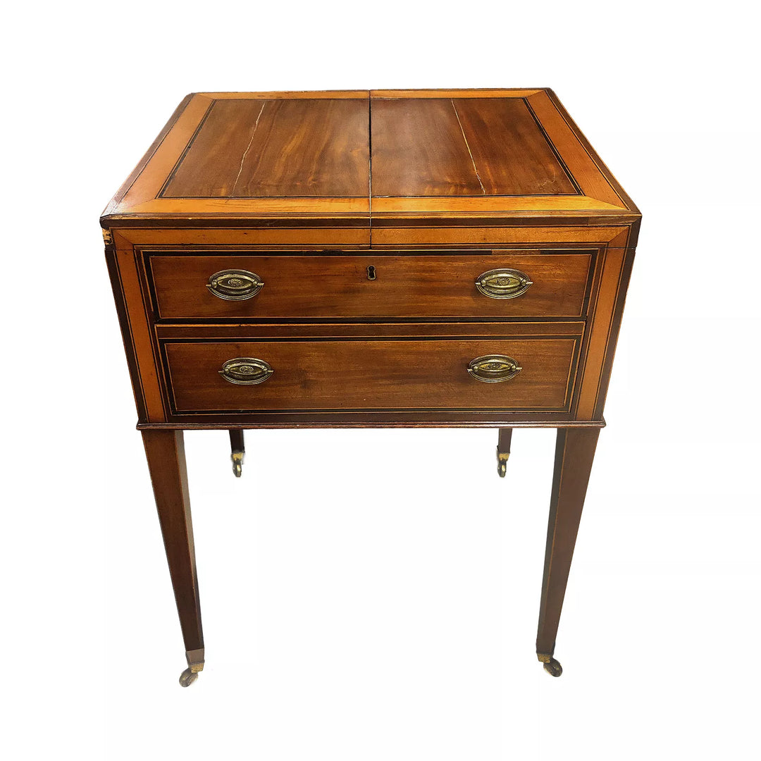 George III Dressing Table Commissioned by Sir Joshua Reynolds, mahogany cabinet with drawers and tapered legs on brass castors.