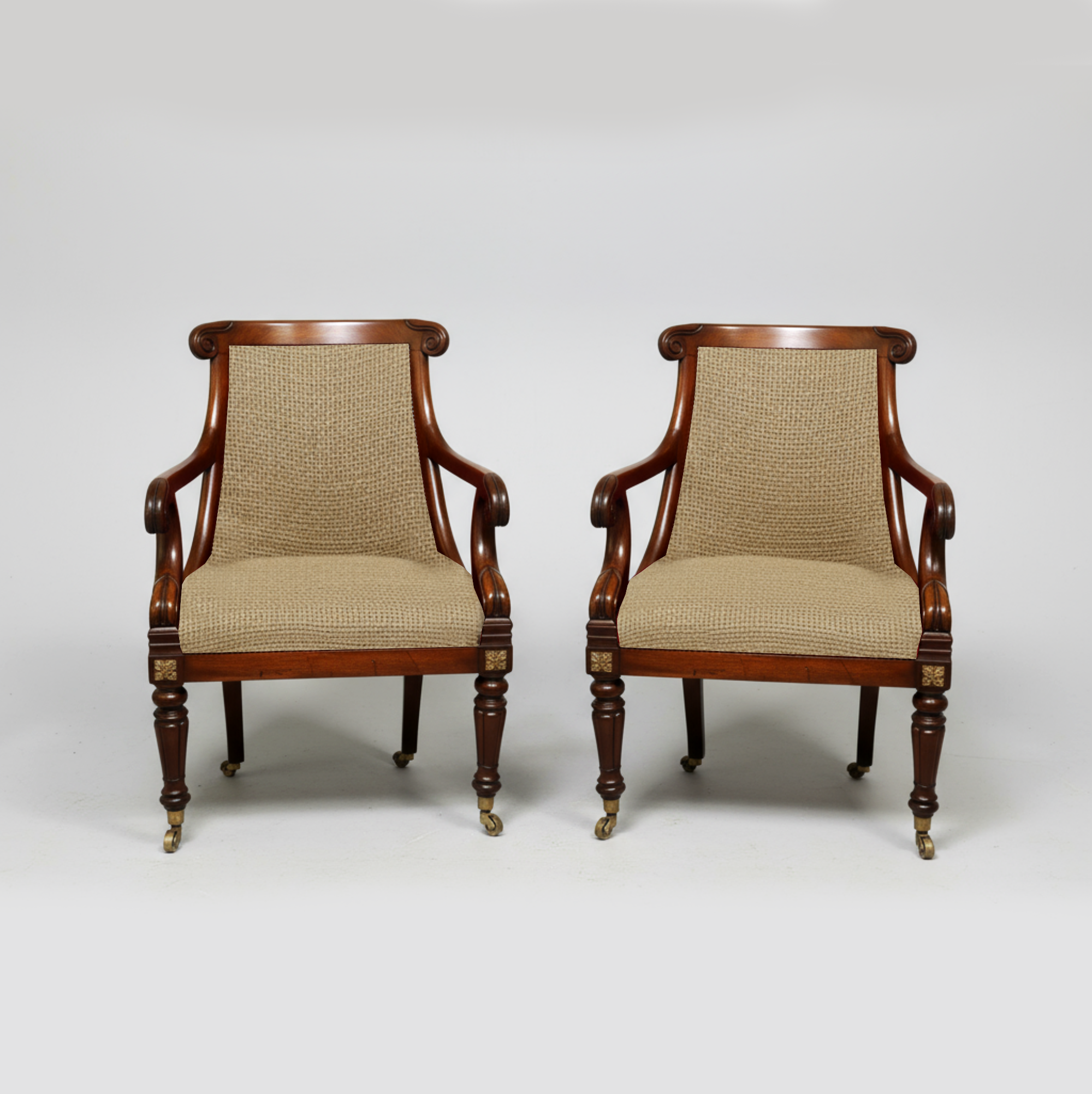 Pair of Regency mahogany tub chairs with beige upholstery and carved detailing by Collection CK40, ideal for library seating