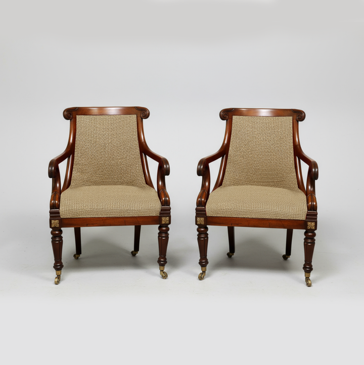 Pair of Regency mahogany tub chairs with beige upholstery and carved detailing by Collection CK40, ideal for library seating