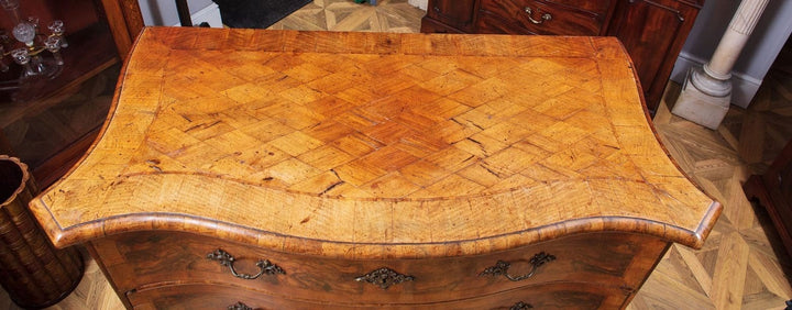 Early 18th Century Italian Walnut Commode with parquetry top, rococo handles, and carved paw feet, circa 1740 Naples.