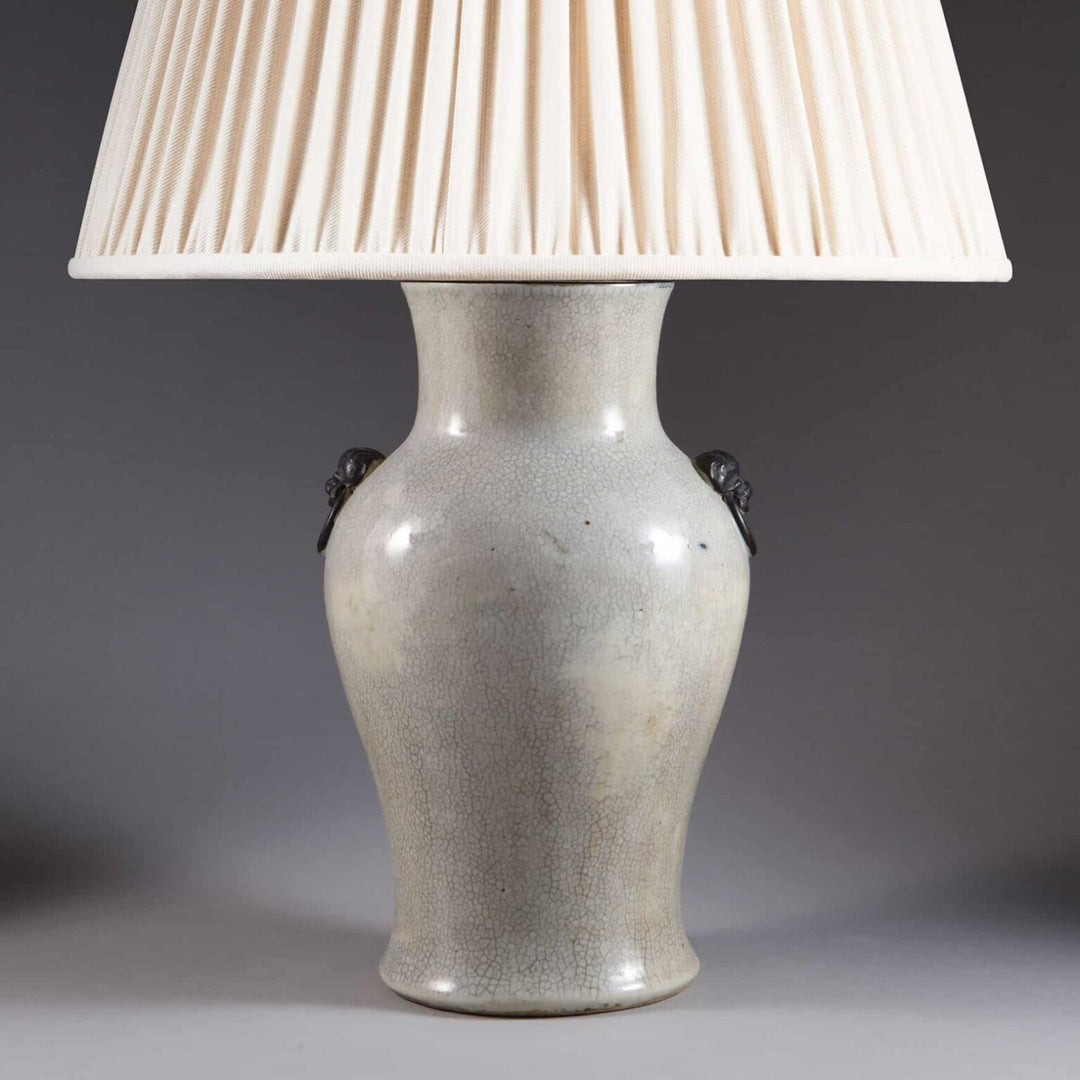 Chinese Crackle Glazed Vase Mounted as a Table Lamp with pleated white lampshade, circa 1900, elegant antique decor piece.