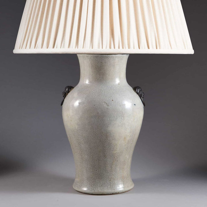 Chinese Crackle Glazed Vase Mounted as a Table Lamp with pleated white lampshade, circa 1900, elegant antique decor piece.