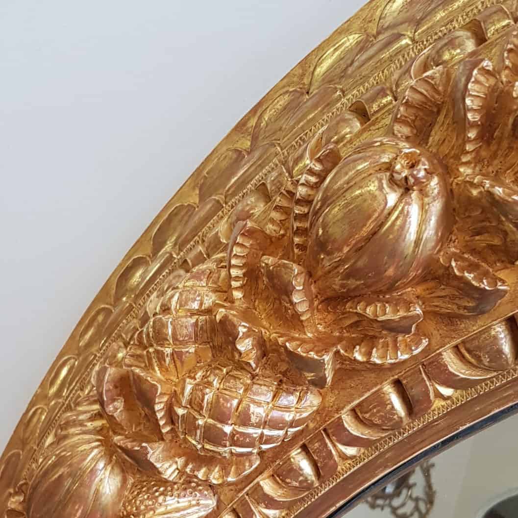 Monumental 5ft Round Italian Mirror with ornate gilded frame carved with fruits and foliage, 19th century Italian design.