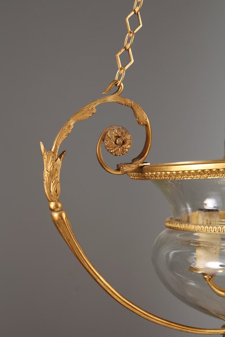 A mid century gilt bronze and glass pendant glass lantern