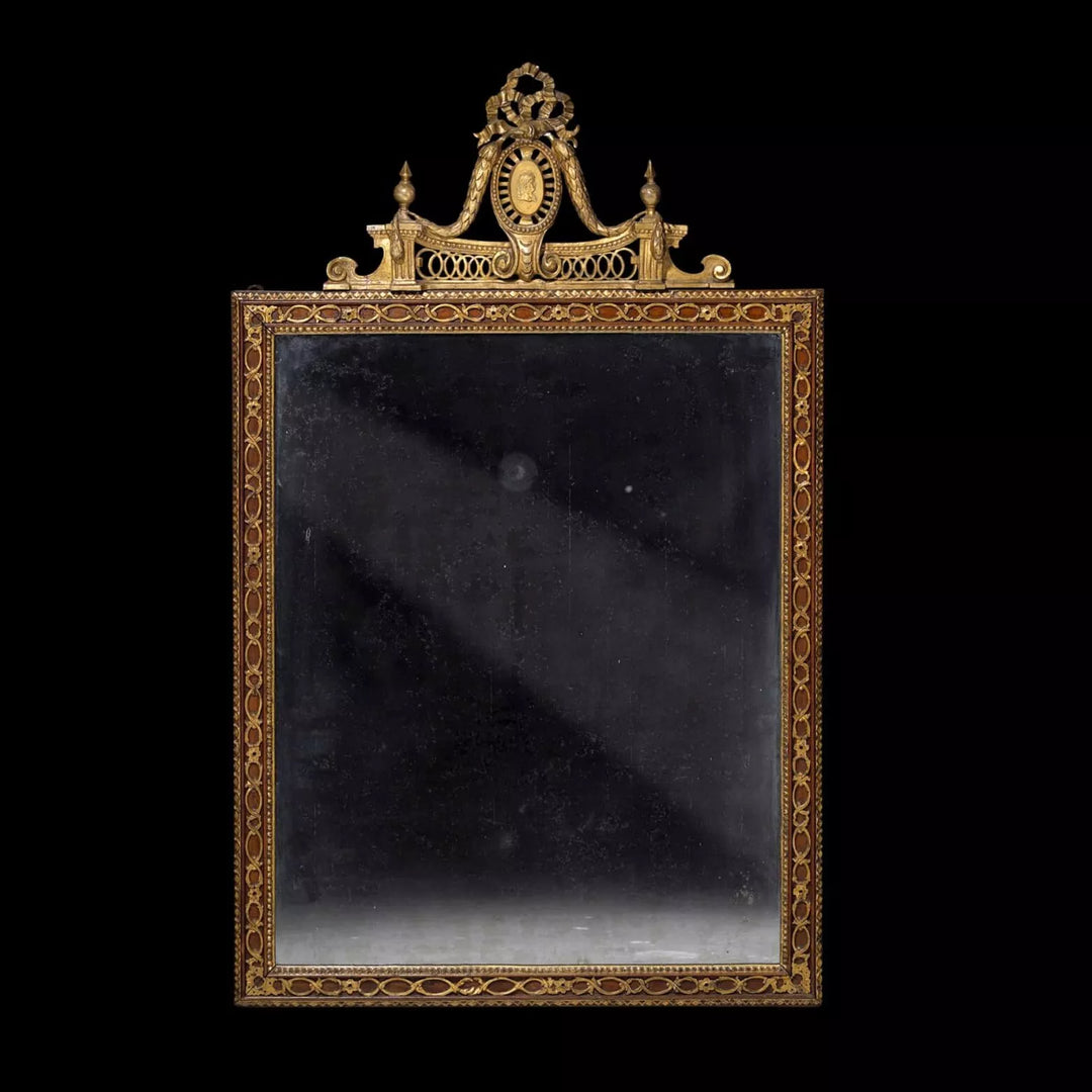 Neo Classical late 18th Century Parcel-gilt Pier Mirror with gilt strapwork and Roman Emperor medallion, Sweden circa 1800.