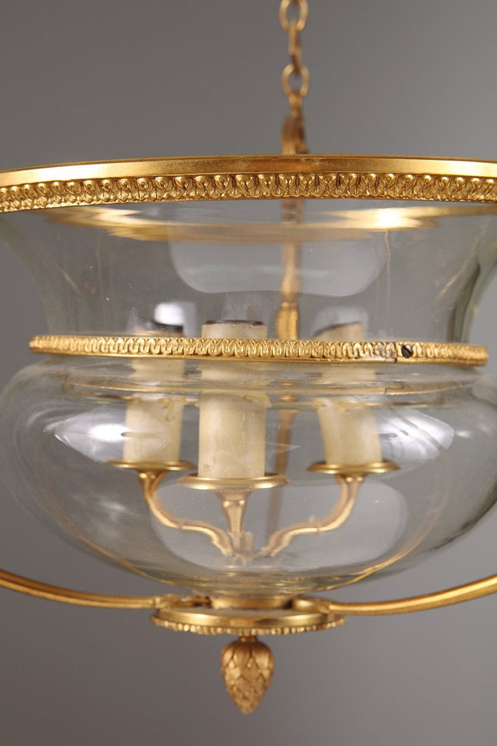 A mid century gilt bronze and glass pendant glass lantern