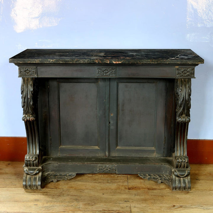 Anglo Indian Ebonised Console Table side cabinet with carved floral details and fluted volute scroll supports circa 1850.