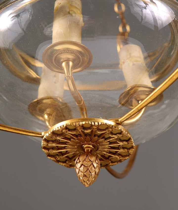 A mid century gilt bronze and glass pendant glass lantern