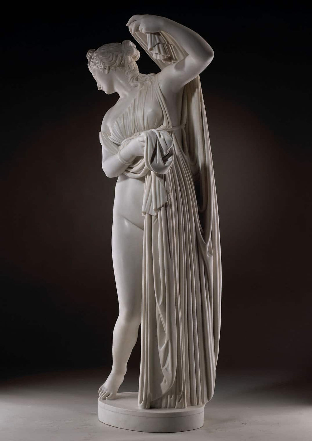 Callipygian Venus marble statue showing a draped female figure from Ancient Rome with detailed folds.