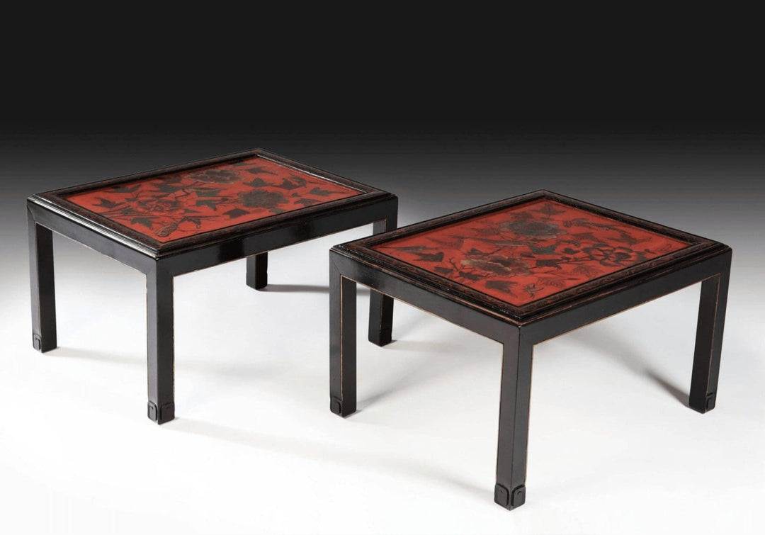 Pair Of Chinese Red Lacquer End Tables with black frames and red bird and foliage panels, circa 1950, mid-20th century design.