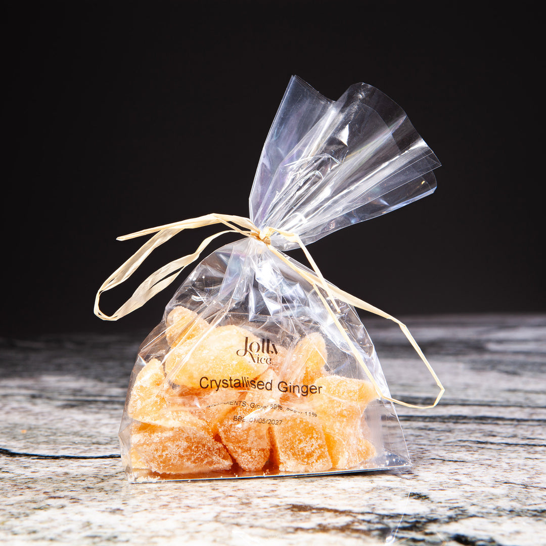 Clear bag of crystallised ginger tied with raffia, featured by Nicholas Wells Antiques for Christmas Hamper 2025
