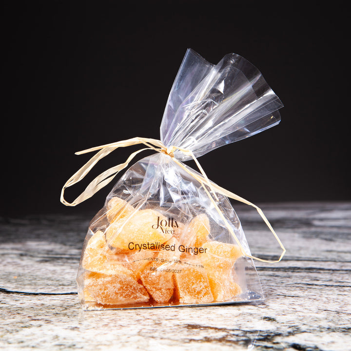 Clear bag of crystallised ginger tied with raffia, featured by Nicholas Wells Antiques for Christmas Hamper 2025