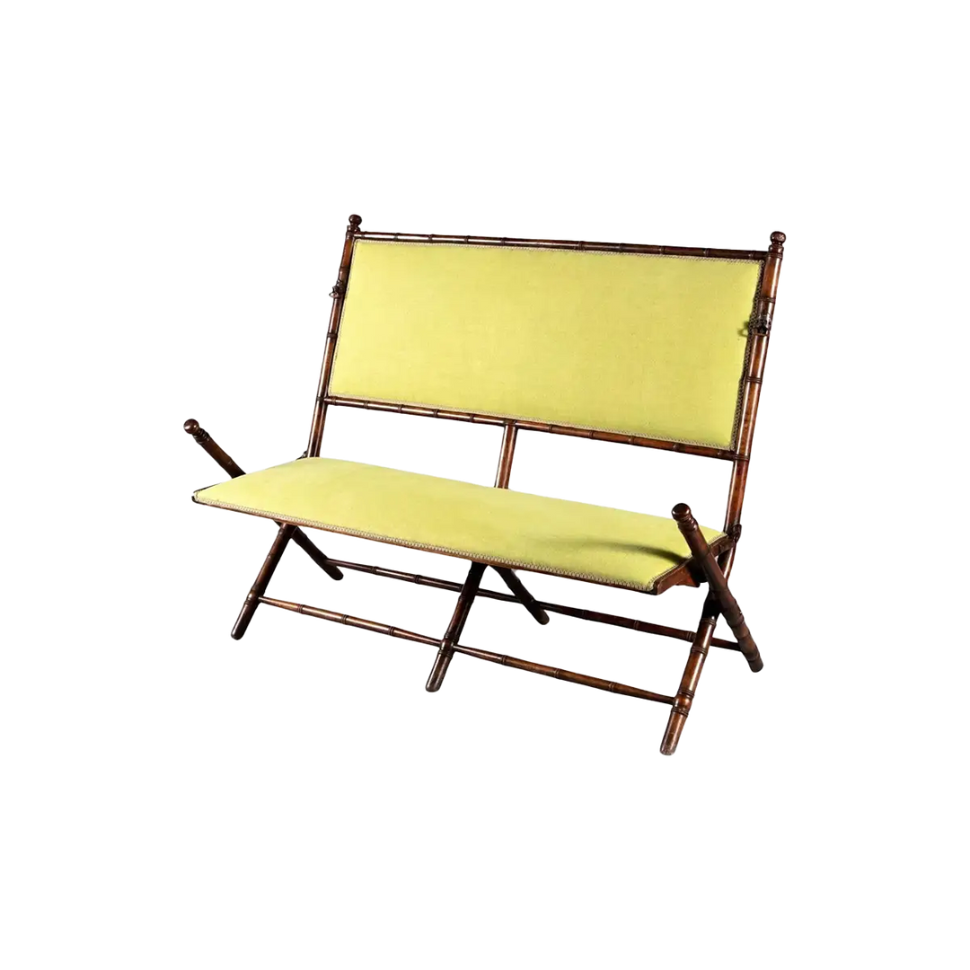 An Edwardian folding simulated bamboo Campaign settee