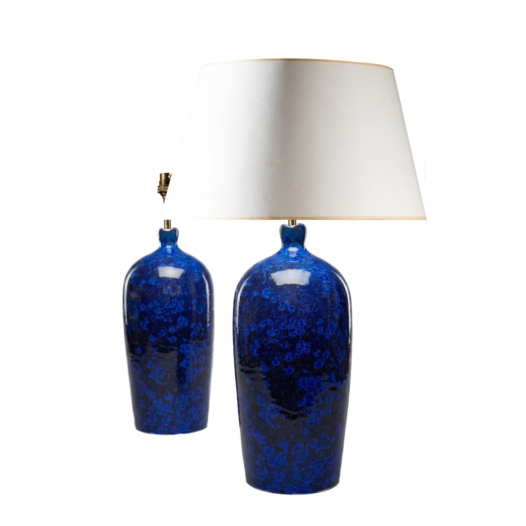 Pair of deep blue crystalline ceramic lamps with scalloped rims by Nicholas Wells Antiques on white background