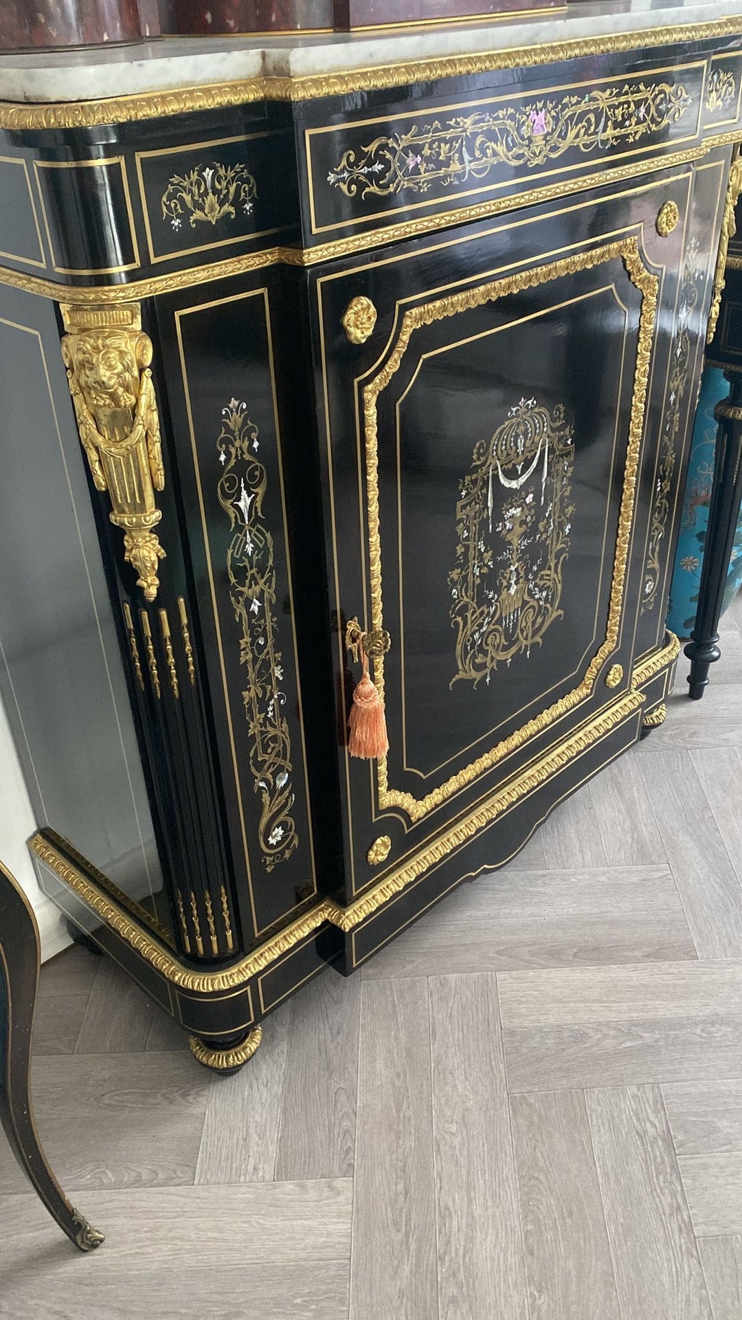 Mother of pearl inlaid ebonised cabinet