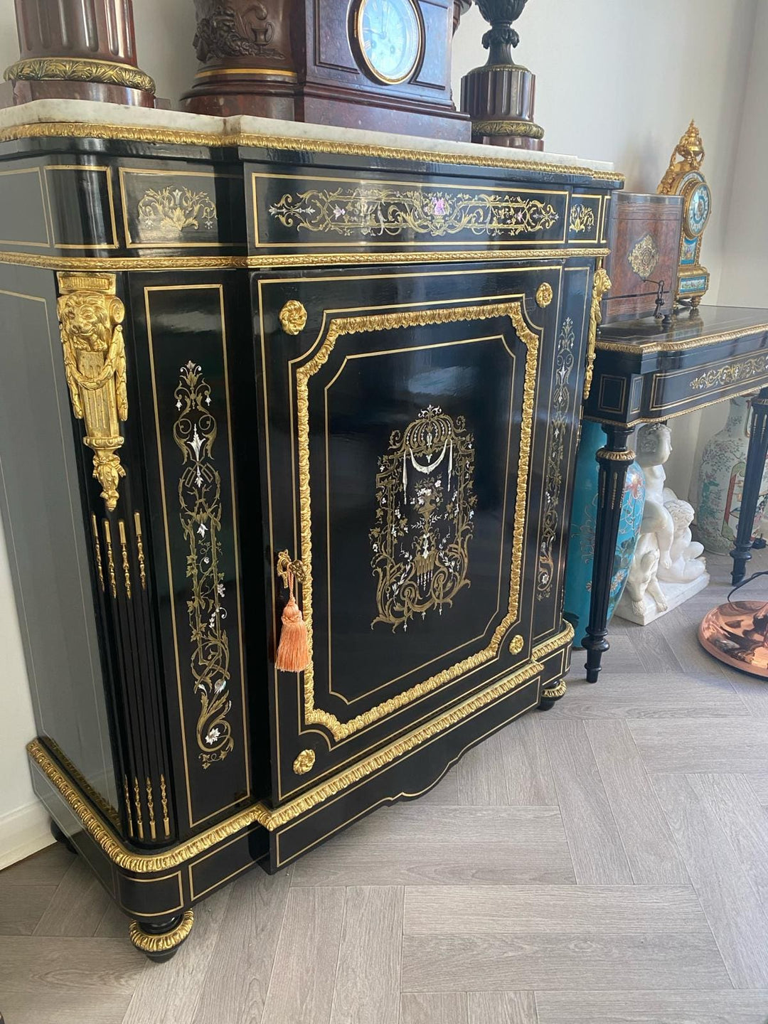 Mother of pearl inlaid ebonised cabinet
