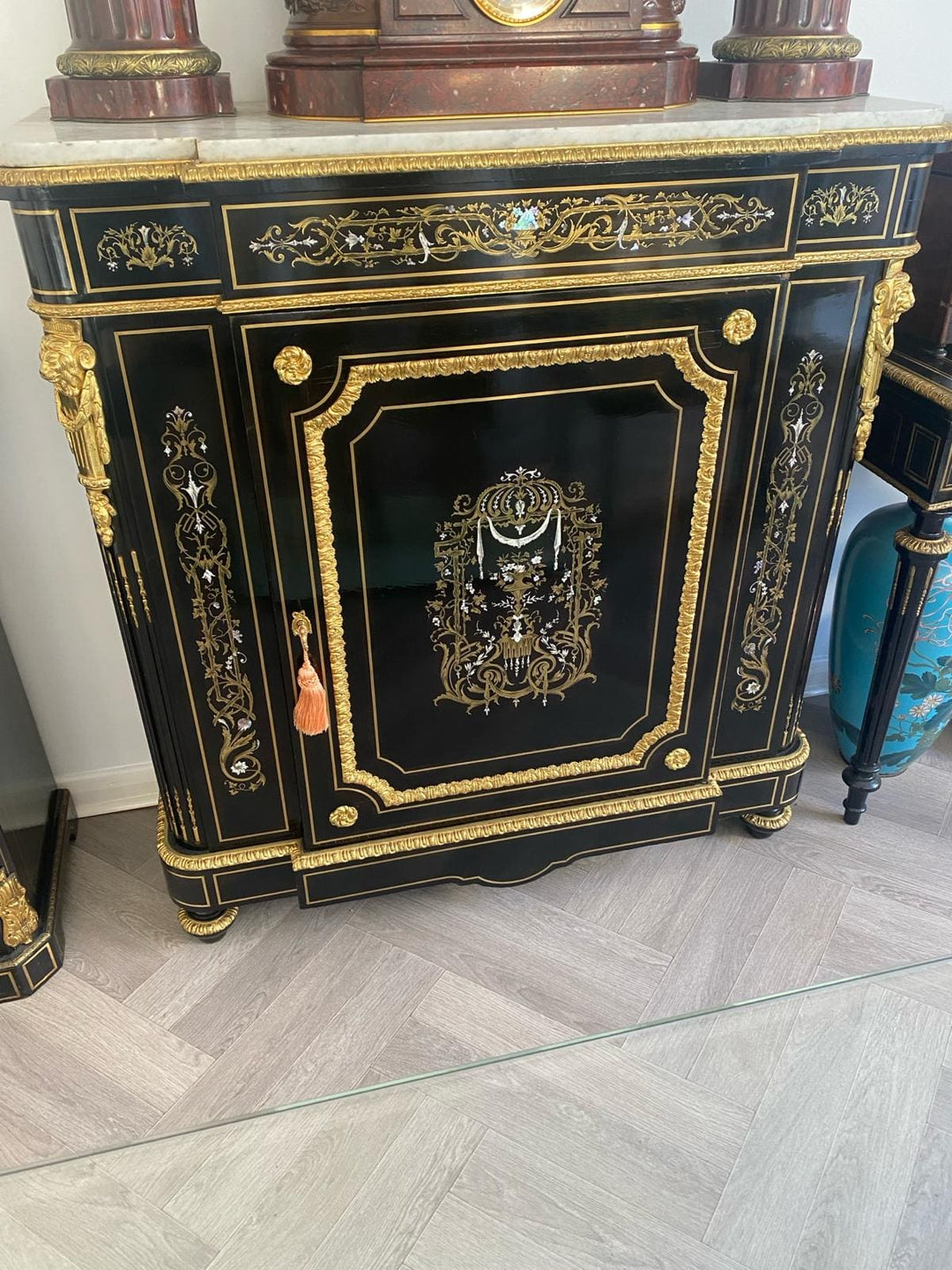 Mother of pearl inlaid ebonised cabinet