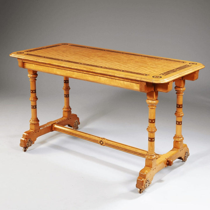 Arts And Crafts Writing Table By Marsh And Jones with satinwood inlay and turned columns on brass casters circa 1900 England