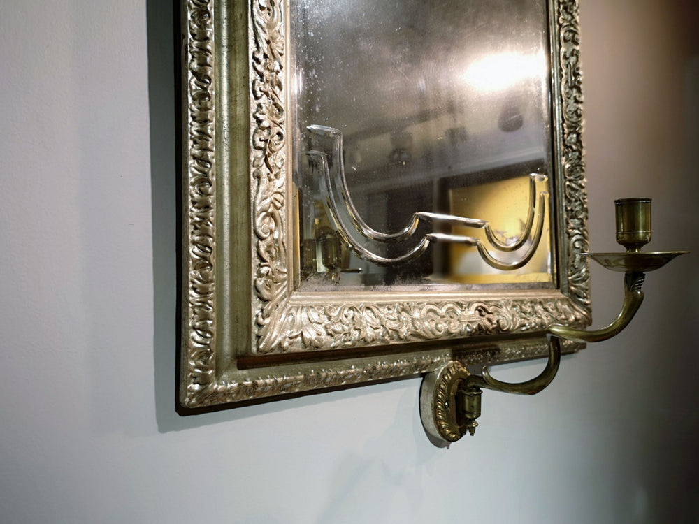 A Queen Anne Silvered Mirror Sconce 90x57cm with bevelled plate and ornate silvered bolection moulded frame.