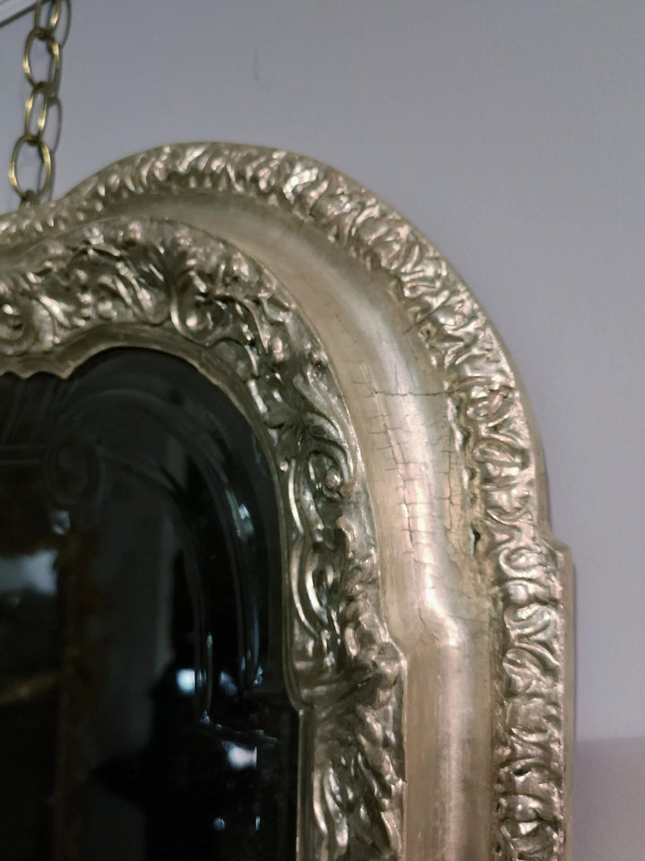 A Queen Anne Silvered Mirror Sconce 90x57cm with ornate silvered bolection moulded frame and bevelled plate.