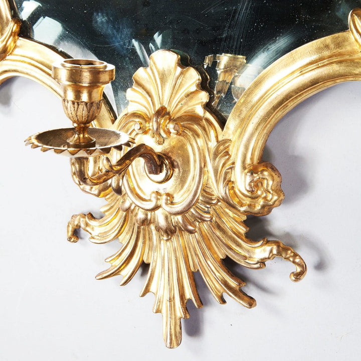 Rare Italian Gilt Bronze Metal Girandole Mirror with ornate scrolls and candle holder, circa 1750, finely beveled mirror plate.