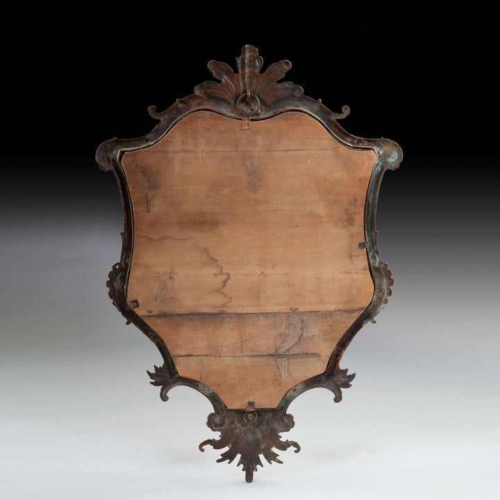 Rare Italian Gilt Bronze Metal Girandole Mirror with curvaceous outline and elaborate scrollwork, circa 1750.